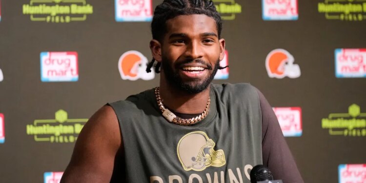 Shedeur Sanders speaking at a press conference.