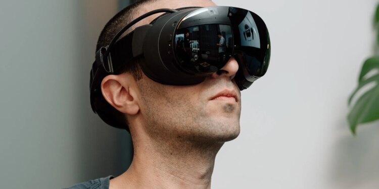 The Verge’s Jay Peters wearing Valve’s Steam Frame VR headset.