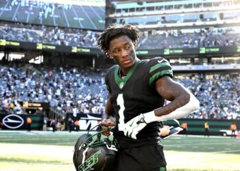 Jets cornerback Sauce Gardner (1) walks off the field after the Dallas Cowboys 37-22 win over the Jets.