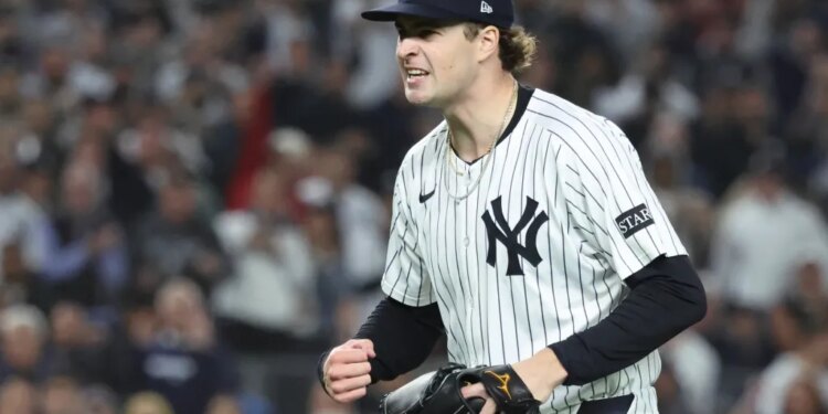 New York Yankees pitcher Cam Schlittler reacts after striking out a Boston Red Sox batter.