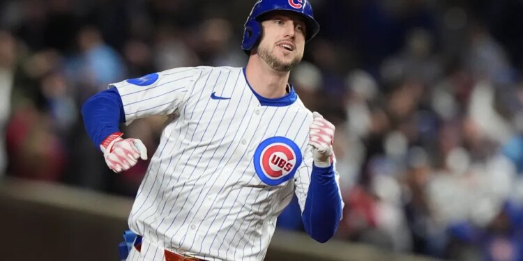 A Chicago Cubs baseball player running.