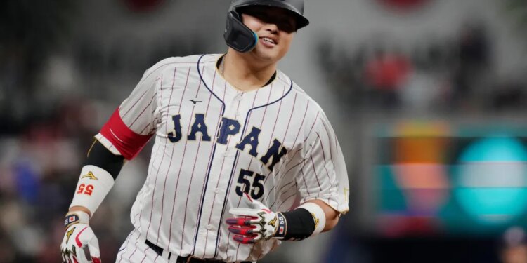 Japan third baseman Munetaka Murakami (55) runs the bases after hitting a home run.