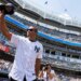 Alex Rodriguez salutes fans, holding his baseball cap in the air, during Old Timer’s Day.