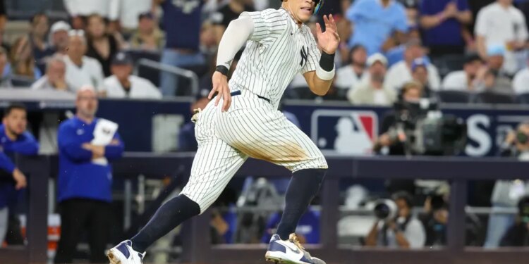 New York Yankees outfielder Aaron Judge (99) is caught in a rundown in the third inning against the Toronto Blue Jays during game three of the ALDS round for the 2025 MLB playoffs at Yankee Stadium.