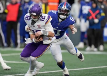 New York Giants linebacker Abdul Carter (51) sacks Minnesota Vikings quarterback Max Brosmer (12).