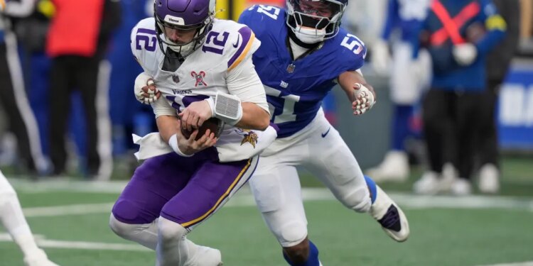 New York Giants linebacker Abdul Carter (51) sacks Minnesota Vikings quarterback Max Brosmer (12).