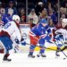New York Rangers defenseman Braden Schneider (4) and Colorado Avalanche players Martin Necas (88) and Ross Colton (20) chase the puck in an ice hockey game.