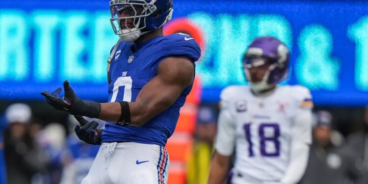 New York Giants outside linebacker Brian Burns (0) reacting during a football game.