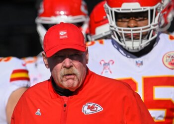 Andy Reid walks onto the field with the Chiefs before their game against the Titans on Dec. 21, 2025.