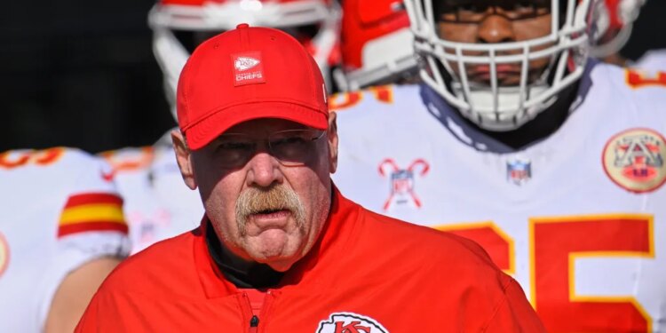 Andy Reid walks onto the field with the Chiefs before their game against the Titans on Dec. 21, 2025.