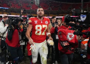 Kansas City Chiefs tight end Travis Kelce walks on the field following an NFL football game against the Denver Broncos Thursday, Dec. 25, 2025, in Kansas City.