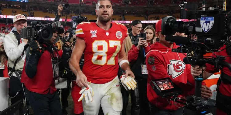 Kansas City Chiefs tight end Travis Kelce walks on the field following an NFL football game against the Denver Broncos Thursday, Dec. 25, 2025, in Kansas City.