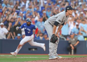 Yankees pitcher Max Fried (54) reacts as the Blue Jays' Vladimir Guerrero Jr. (27) scores on a Daulton Varsho double in Game 2 of the ALDS on Oct. 5, 2025.