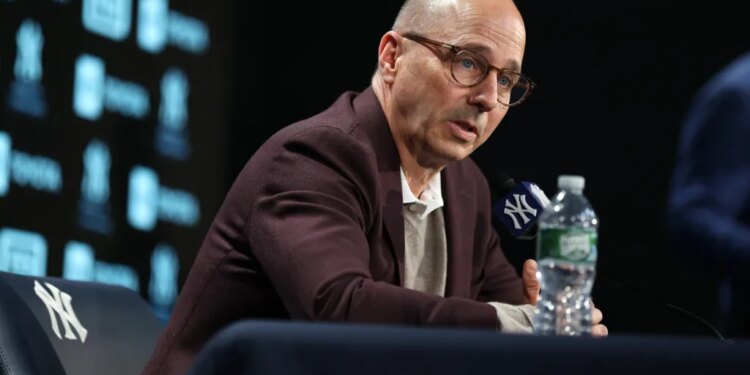 New York Yankees GM Brian Cashman speaking at a press conference.