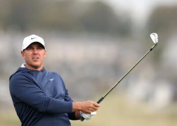 Golfer in a white cap and navy top holding a golf club at the Alfred Dunhill Links Championship 2025 - Day One.