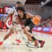 Harvard Crimson forward Thomas Batties II (15) looks to drive past St. John's Red Storm forward Bryce Hopkins (23) in the first half at Carnesecca Arena.