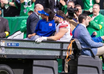 New York Giants running back Cam Skattebo (44) is carted off the field after twisting his ankle during the first half.
