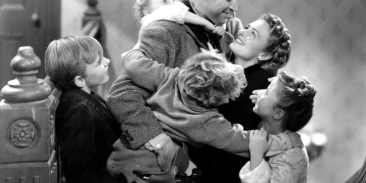 James Stewart embracing Donna Reed and four children.