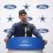 Dallas Cowboys coach Brian Schottenheimer speaking at a press conference.