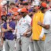 Clemson Tigers offensive coordinator Garrett Riley and other coaches on the sideline.