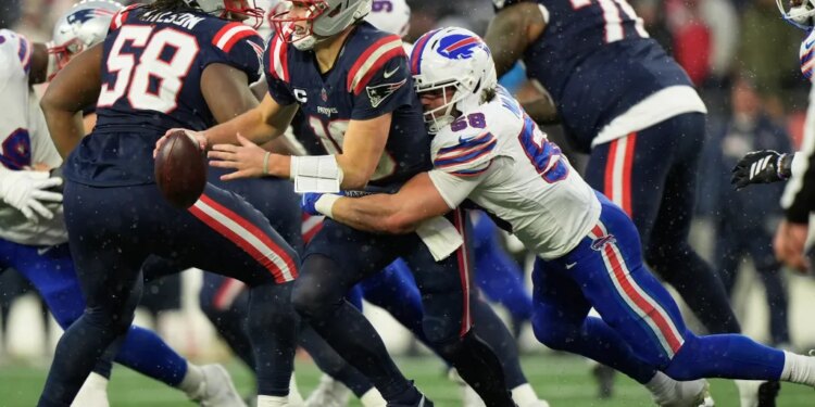 Buffalo Bills linebacker Matt Milano sacks New England Patriots quarterback Drake Maye.