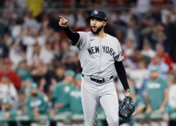 Devin Williams #38 of the New York Yankees reacts after ending the 8th inning.
