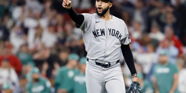 Devin Williams #38 of the New York Yankees reacts after ending the 8th inning.