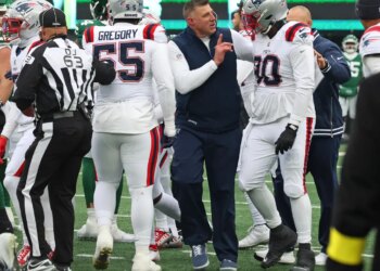 New England Patriots defensive tackle Christian Barmore (90) argues with his coaching staff.