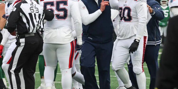 New England Patriots defensive tackle Christian Barmore (90) argues with his coaching staff.