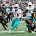 Miami Dolphins running back De'Von Achane (28) running with the ball against the New York Jets.