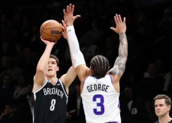 Egor Dëmin shoots a 3-pointer over Keyonte George during the Nets' 123-110 home loss to the Jazz on Dec. 4, 2025.