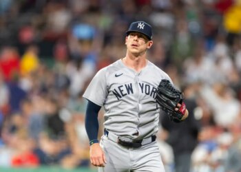 Ian Hamilton, a New York Yankees player, walking back to the dugout.