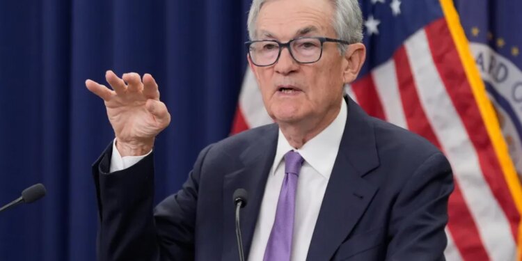 Jerome Powell speaking at a news conference.