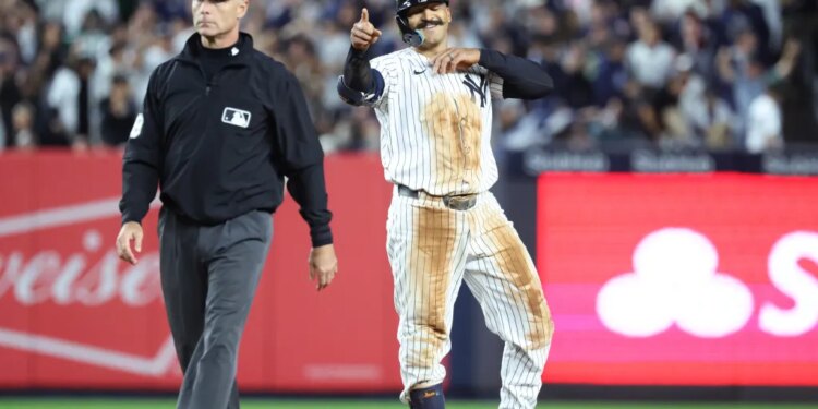 Trent Grisham #12 of the New York Yankees reacts after he hits a double during the 7th inning. The New York Yankees defeat the Boston Red Sox 4-3.