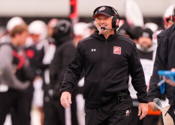 Utah head coach Kyle Whittingham on the sideline during a football game.