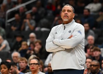 Georgetown Hoyas head coach Ed Cooley with arms crossed.