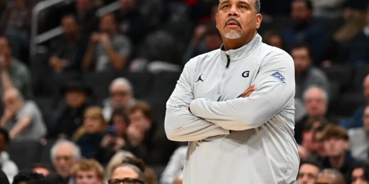 Georgetown Hoyas head coach Ed Cooley with arms crossed.