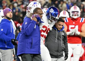 New York Giants running back Tyrone Tracy Jr. (29) is helped off the field.