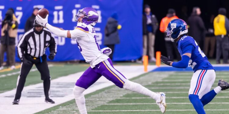 Wide receiver Justin Jefferson #18 of the Minnesota Vikings completes a reception during the second half at MetLife Stadium.