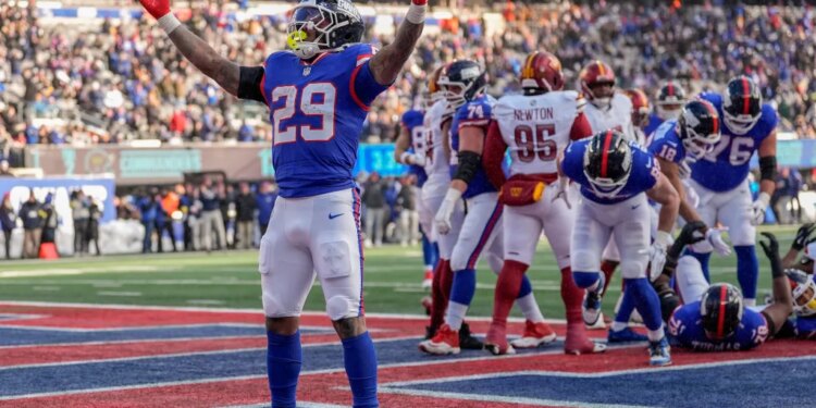 New York Giants running back Tyrone Tracy Jr. (29) reacts after scoring a touchdown.