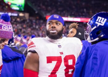 Andrew Thomas #78 of the New York Giants reacts on the sideline during the second half at Gillette Stadium, Monday, Dec.. 1, 2025.