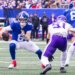Quarterback Jaxson Dart #6 of the New York Giants is forced out of the pocket by linebacker Blake Cashman #51 of the Minnesota Vikings during the first half at MetLife Stadium, Sunday, Dec. 21, 2025, in East Rutherford, New Jersey.