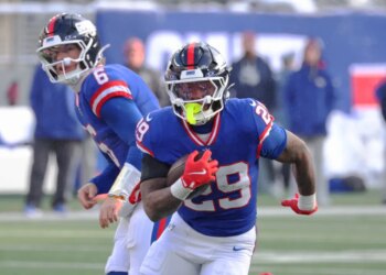 Running back Tyrone Tracy Jr. #29 of the New York Giants runs the ball during the first half.