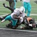 Dolphins running back De'Von Achane (28) runs the ball for a touchdown against a Jets player.