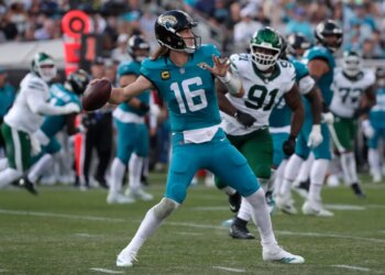 Jacksonville Jaguars quarterback Trevor Lawrence (16) throws the ball during the third quarter against the New York Jets.