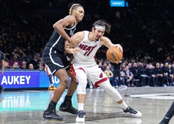 Noah Clowney #21 of the Brooklyn Nets defends against Jaime Jaquez Jr. #11 of the Miami Heat during the second half at Barclays Center, Thursday, Dec. 18, 2025, in Brooklyn, NY.