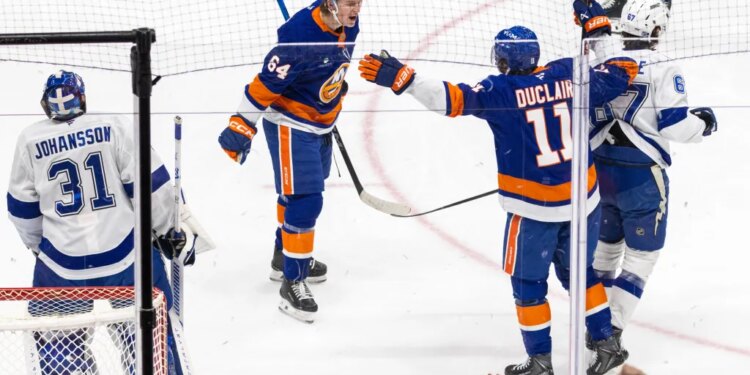 New York Islanders center Calum Ritchie (64) reacts after he scores a goal during the first period at UBS Arena, Saturday, Dec. 13, 2025, in Elmont, NY.