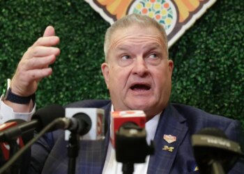 Michigan interim head coach Biff Poggi answers a question during an NCAA college football Citrus Bowl news conference in Winter Park, Fla., Monday, Dec. 15, 2025.