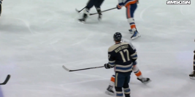 Mat Barzal winds up his stick to swing at Mason Marchment during a game on Sunday.
