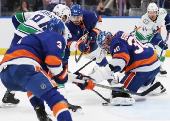 New York Islanders goaltender Ilya Sorokin (30) makes a save during the second period of a game against the Vancouver Canucks at UBS Arena in Elmont, N.Y. on Friday, Dec. 19, 2025.